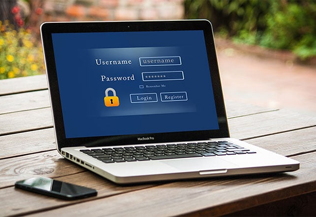Laptop on a table with a login screen
